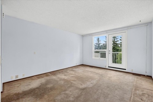 212 Stravanan Bay Sw, Calgary, AB - Indoor Photo Showing Other Room