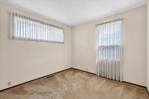 212 Stravanan Bay Sw, Calgary, AB - Indoor Photo Showing Other Room