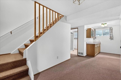212 Stravanan Bay Sw, Calgary, AB - Indoor Photo Showing Other Room