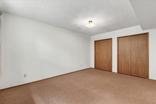 212 Stravanan Bay Sw, Calgary, AB - Indoor Photo Showing Other Room