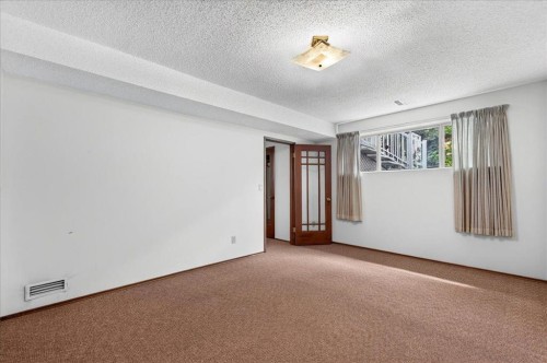212 Stravanan Bay Sw, Calgary, AB - Indoor Photo Showing Other Room