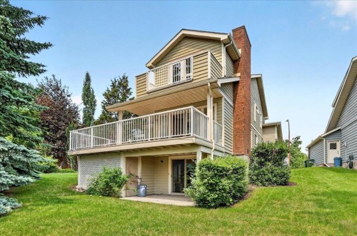 212 Stravanan Bay Sw, Calgary, AB - Outdoor With Deck Patio Veranda