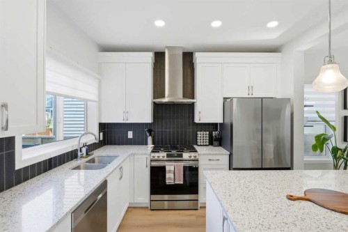 591 Lawthorn Way Se, Airdrie, AB - Indoor Photo Showing Kitchen With Stainless Steel Kitchen With Double Sink With Upgraded Kitchen