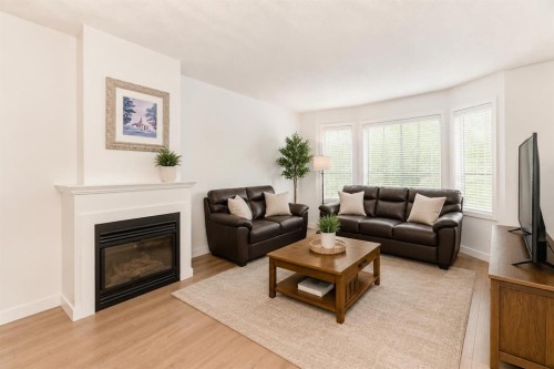 101 Hidden Valley Villas Nw, Calgary, AB - Indoor Photo Showing Living Room With Fireplace