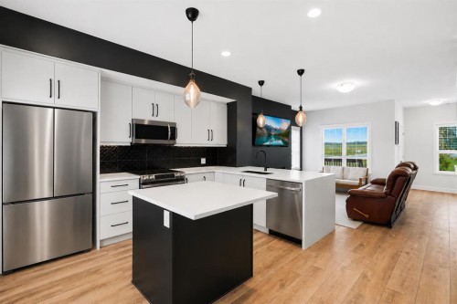 1801-32 Horseshoe Crescent, Cochrane, AB - Indoor Photo Showing Kitchen With Stainless Steel Kitchen With Upgraded Kitchen