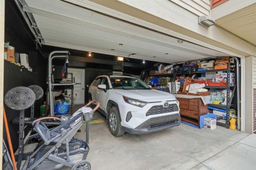 1801-32 Horseshoe Crescent, Cochrane, AB - Indoor Photo Showing Garage