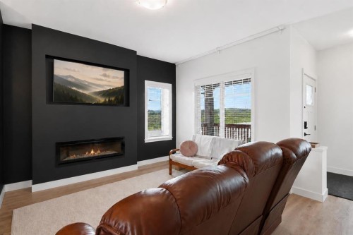 1801-32 Horseshoe Crescent, Cochrane, AB - Indoor Photo Showing Living Room With Fireplace