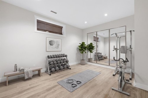 129 Kingsbury Close Se, Airdrie, AB - Indoor Photo Showing Gym Room