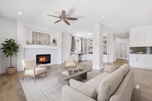 129 Kingsbury Close Se, Airdrie, AB - Indoor Photo Showing Living Room With Fireplace