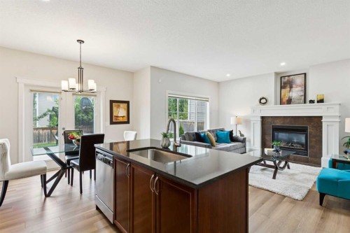 257 Cougartown Circle Sw, Calgary, AB - Indoor Photo Showing Living Room With Fireplace