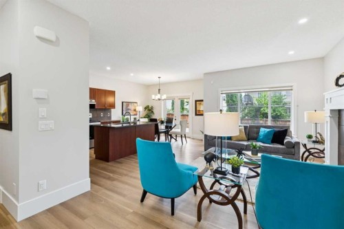 257 Cougartown Circle Sw, Calgary, AB - Indoor Photo Showing Living Room With Fireplace