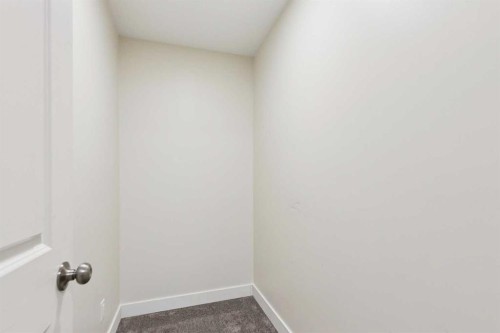 257 Cougartown Circle Sw, Calgary, AB - Indoor Photo Showing Other Room