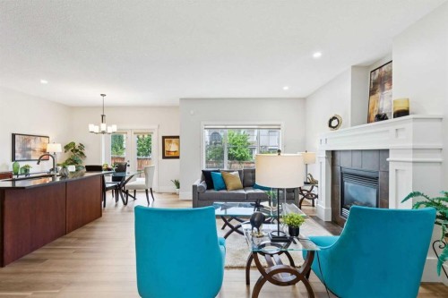 257 Cougartown Circle Sw, Calgary, AB - Indoor Photo Showing Living Room With Fireplace