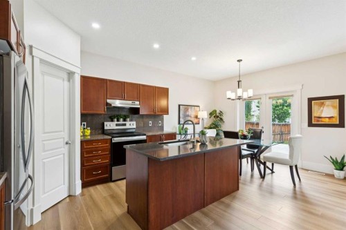 257 Cougartown Circle Sw, Calgary, AB - Indoor Photo Showing Kitchen With Double Sink