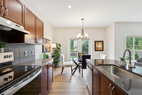 257 Cougartown Circle Sw, Calgary, AB - Indoor Photo Showing Kitchen With Upgraded Kitchen