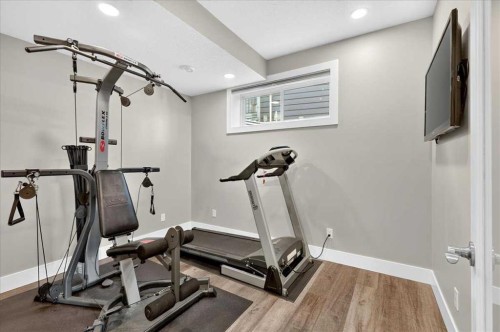 69 Cimarron Springs Circle, Okotoks, AB - Indoor Photo Showing Gym Room