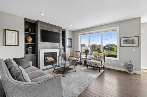 69 Cimarron Springs Circle, Okotoks, AB - Indoor Photo Showing Living Room With Fireplace