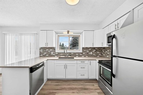 2016 46 Street Se, Calgary, AB - Indoor Photo Showing Kitchen With Upgraded Kitchen