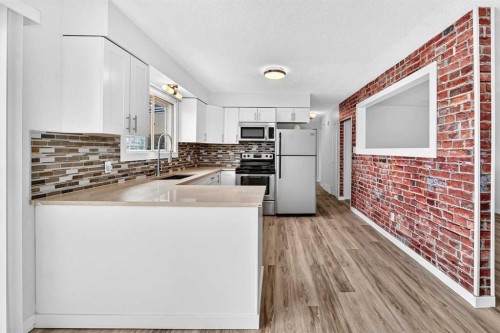 2016 46 Street Se, Calgary, AB - Indoor Photo Showing Kitchen With Double Sink