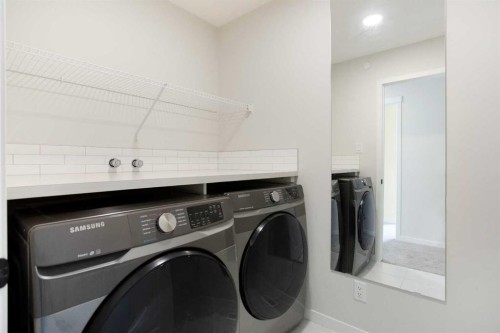 112 Lucas Street Nw, Calgary, AB - Indoor Photo Showing Laundry Room