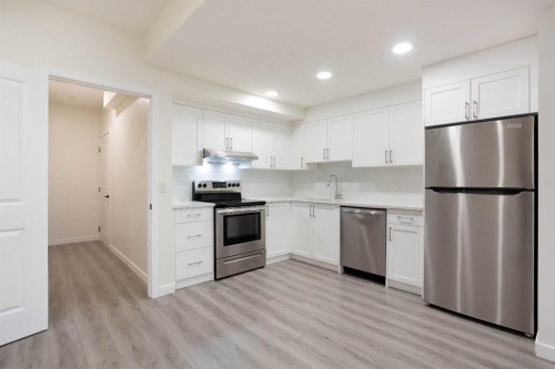 112 Lucas Street Nw, Calgary, AB - Indoor Photo Showing Kitchen With Stainless Steel Kitchen With Upgraded Kitchen