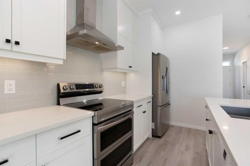 112 Lucas Street Nw, Calgary, AB - Indoor Photo Showing Kitchen With Stainless Steel Kitchen With Upgraded Kitchen