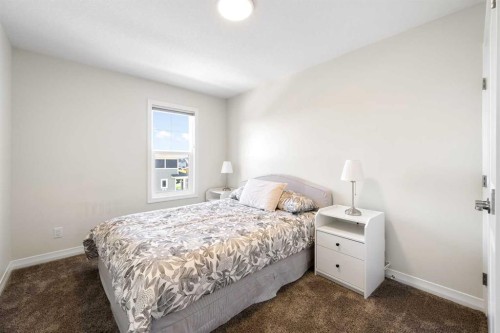 31 Magnolia Grove Se, Calgary, AB - Indoor Photo Showing Bedroom