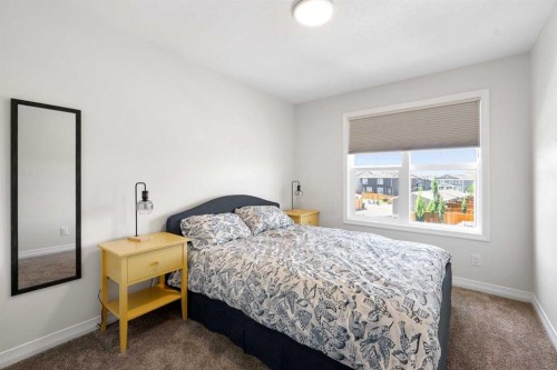 31 Magnolia Grove Se, Calgary, AB - Indoor Photo Showing Bedroom