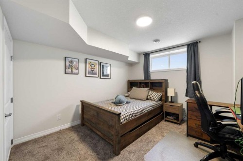 31 Magnolia Grove Se, Calgary, AB - Indoor Photo Showing Bedroom