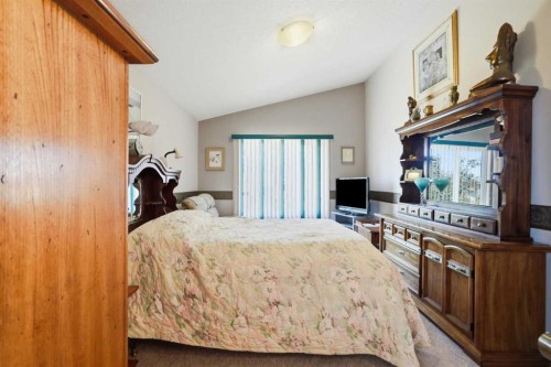 164 Sunterra Heights, Cochrane, AB - Indoor Photo Showing Bedroom