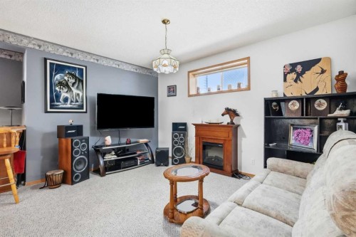 164 Sunterra Heights, Cochrane, AB - Indoor With Fireplace