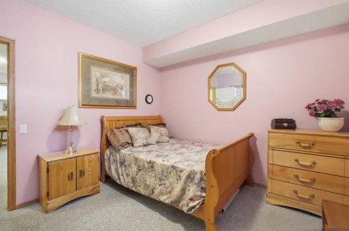 164 Sunterra Heights, Cochrane, AB - Indoor Photo Showing Bedroom