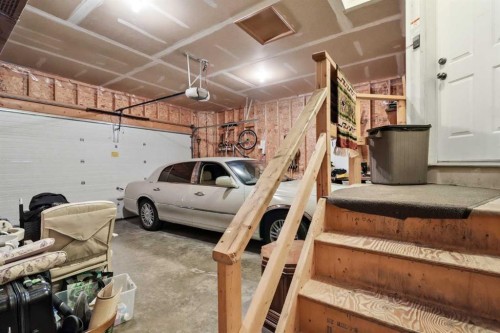 164 Sunterra Heights, Cochrane, AB - Indoor Photo Showing Garage