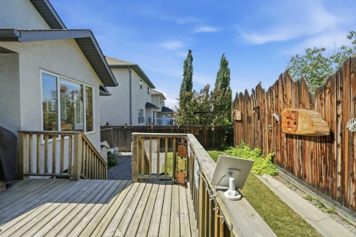164 Sunterra Heights, Cochrane, AB - Outdoor With Deck Patio Veranda With Exterior