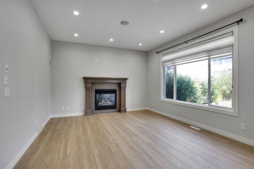 117 Hawkmere Place, Chestermere, AB - Indoor Photo Showing Living Room With Fireplace