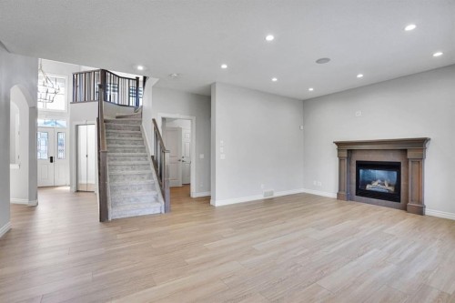 117 Hawkmere Place, Chestermere, AB - Indoor Photo Showing Living Room With Fireplace