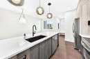 2445 Creeker Lane, Airdrie, AB  - Indoor Photo Showing Kitchen With Upgraded Kitchen 