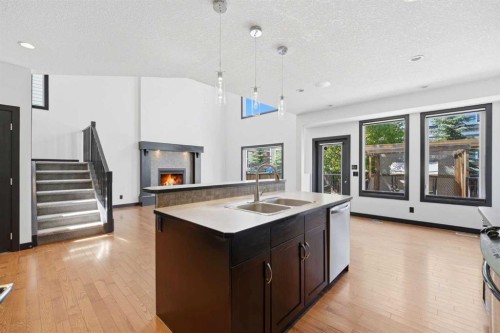 130 Auburn Glen Circle Se, Calgary, AB - Indoor Photo Showing Kitchen With Fireplace With Double Sink