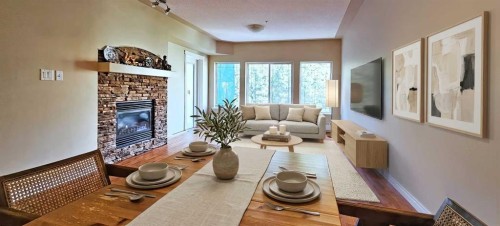 305-30 Discovery Ridge Close Sw, Calgary, AB - Indoor Photo Showing Living Room With Fireplace