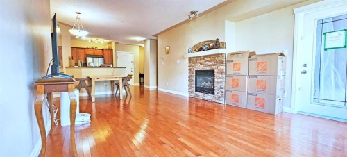 305-30 Discovery Ridge Close Sw, Calgary, AB - Indoor With Fireplace