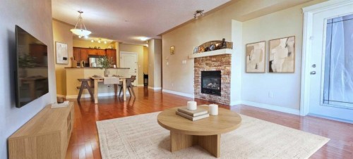 305-30 Discovery Ridge Close Sw, Calgary, AB - Indoor Photo Showing Living Room With Fireplace