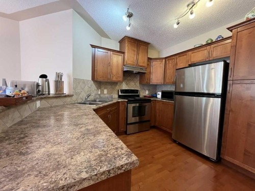 305-30 Discovery Ridge Close Sw, Calgary, AB - Indoor Photo Showing Kitchen With Double Sink