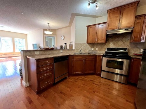 305-30 Discovery Ridge Close Sw, Calgary, AB - Indoor Photo Showing Kitchen With Double Sink
