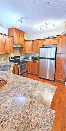 305-30 Discovery Ridge Close Sw, Calgary, AB - Indoor Photo Showing Kitchen With Double Sink