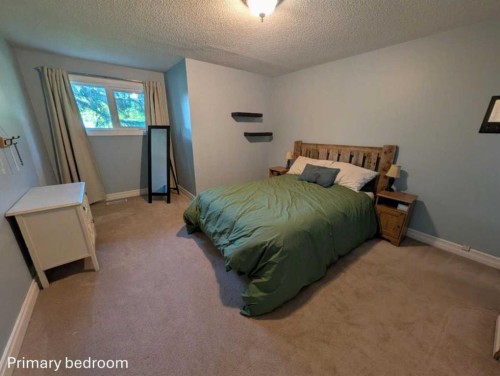 703 5 Avenue West, Brooks, AB - Indoor Photo Showing Bedroom