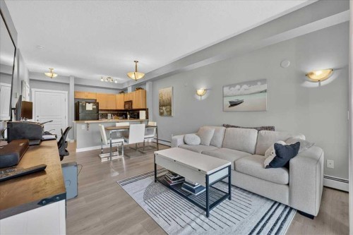 2103-211 Aspen Stone Boulevard Sw, Calgary, AB - Indoor Photo Showing Living Room