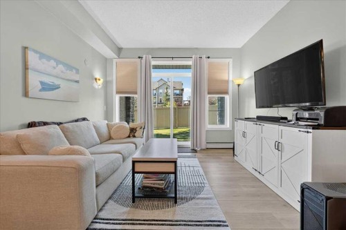 2103-211 Aspen Stone Boulevard Sw, Calgary, AB - Indoor Photo Showing Living Room