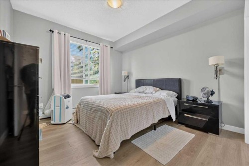 2103-211 Aspen Stone Boulevard Sw, Calgary, AB - Indoor Photo Showing Bedroom