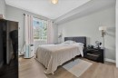 2103-211 Aspen Stone Boulevard Sw, Calgary, AB  - Indoor Photo Showing Bedroom 