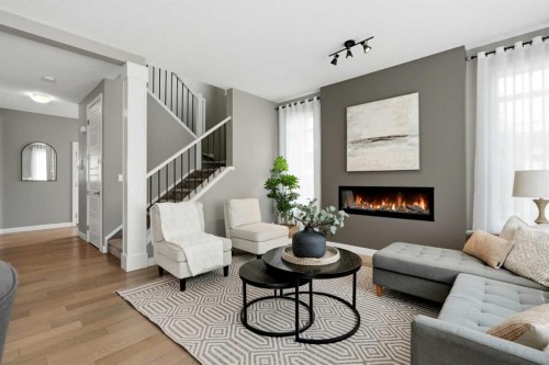 201 Marina Key, Chestermere, AB - Indoor Photo Showing Living Room With Fireplace